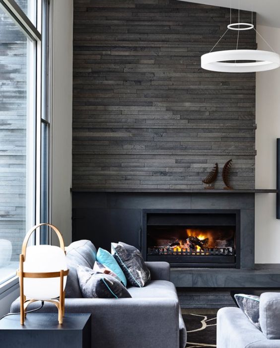 a reclaimed wood panel wall to highlight the fireplace