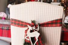 09 plaid ribbons with evergreens and deer for chair decor and a plaid tablecloth