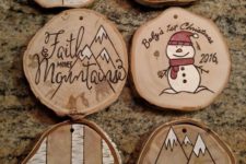 09 wood burnt and painted wood slice ornaments with snowmen, a moose, a bear and mountains