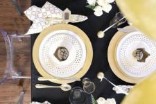 10 a chic black and gold tablescape with polka dots, geo prints and some white blooms