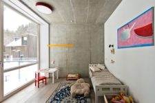 11 The kids’ space is colorful and cute yet with concrete walls and wooden floors like everywhere else
