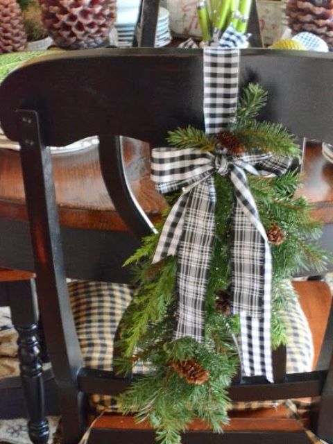 a buffalo check hanging with evergreens and pinecones for cool chair decor