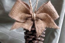 11 a burlap and pinecone ornament with twine for Christmas