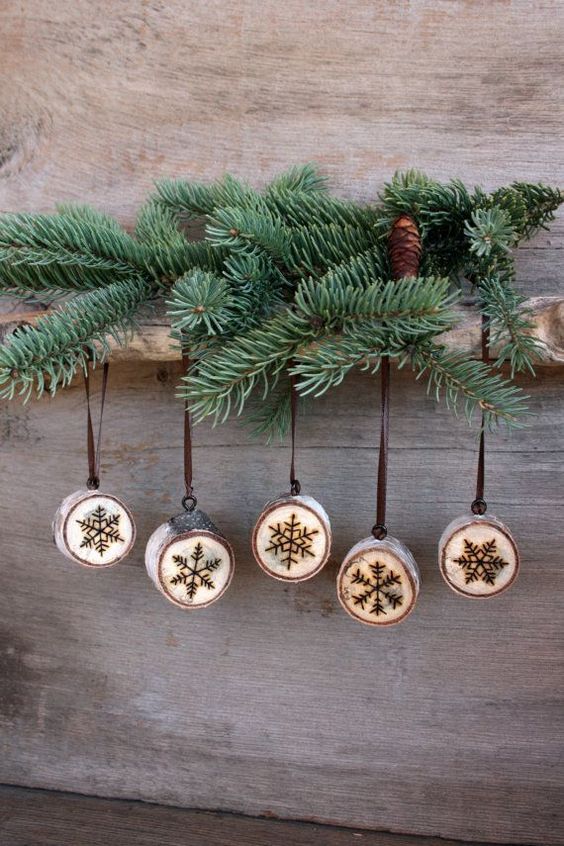 cute wood burnt snowlflake ornaments look rustic and very cute