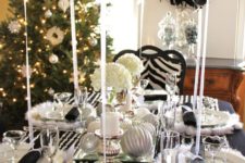 12 a black tablecloth, crystal garlands, faux fur placemats, black balloons and silver ornaments