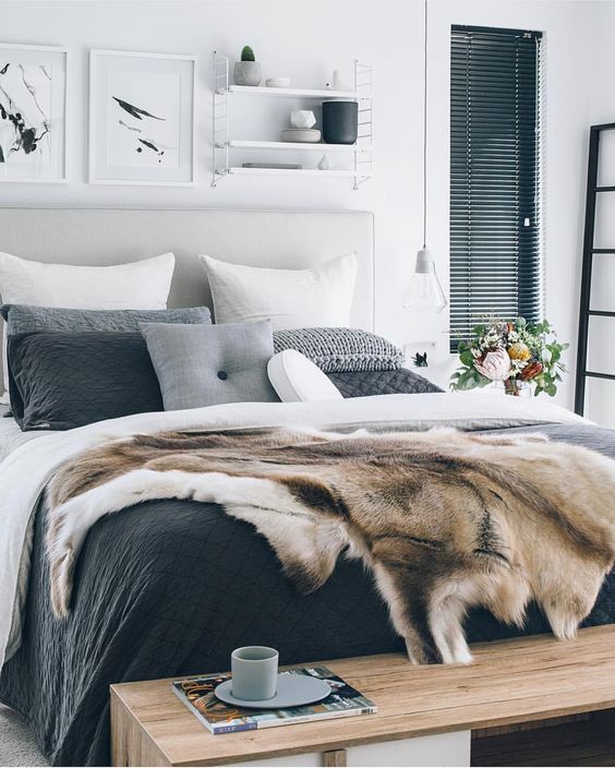 stylish grey, white and black bedding, faux fur and a chunky knit pillow
