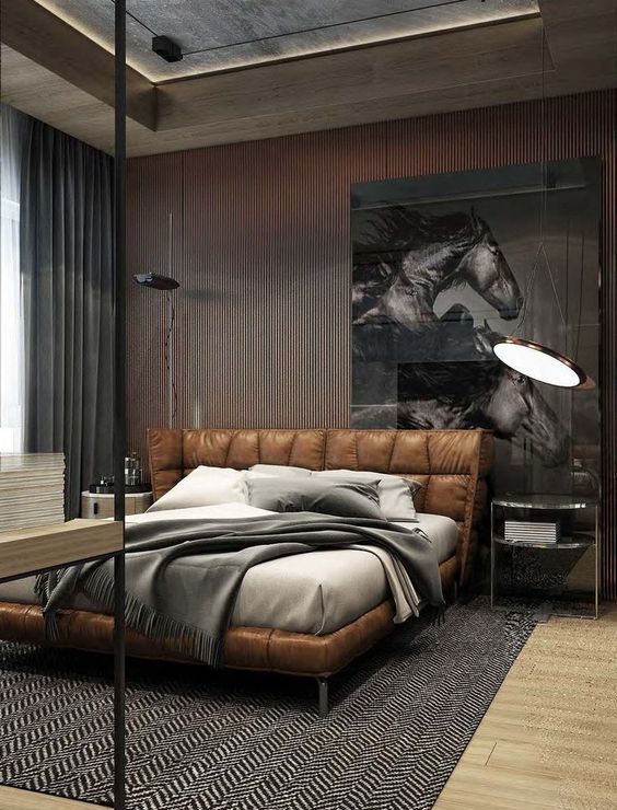 a gorgeous leather upholstered and padded bed for a chic and refined masculine bedroom
