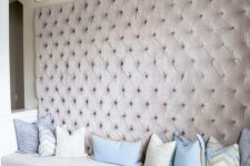 13 a whole wall upholstered with blush velvet guarantess a glam and girlish feel in the space