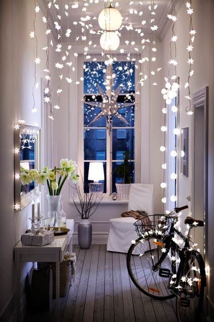 lots of string lights over the small entryway, several lamps and a shining star make it super welcoming