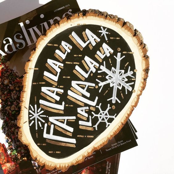 a black, white and gold Christmas sign with snowflakes and chic gilded touches