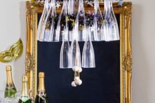 14 a glass and stirrers chandelier over the bar cart will make the drink station cooler