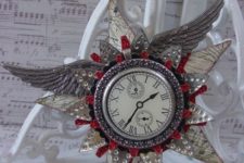 14 a steampunk decoration with wings, stars, a clock and some glitter touches