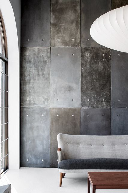add a touch of industrial style with metal and concrete wall panels