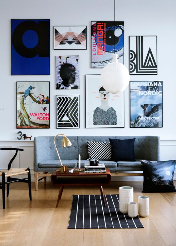 make the sofa wall more interesting with a bold gallery wall with various posters