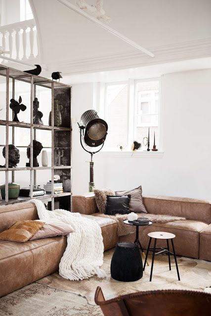 a large corner brown leather sofa for an industrial-inspired space