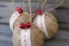 17 burlap ornaments with ribbon and red jingle bells are great for rustic tree decor