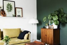 17 white walls and a dark green wall for an accent make the space feel airy