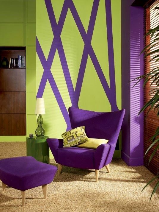 a violet upholstered chair and footrest, a matching pillar and a geometric artwork