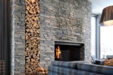 18 highlight your fireplace with a whole sone clad wall with firewood storage