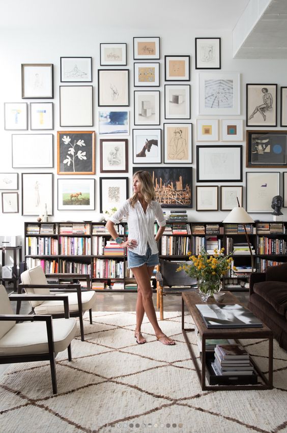 if you have high ceilings, a large gallery wall will make your blank space cooler