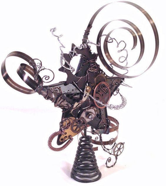 a crazy steampunk star tree topper with various gears and other details looks unusual