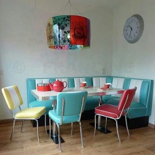 a dining zone in turquoise, red and yellow in the corner of the kitchen