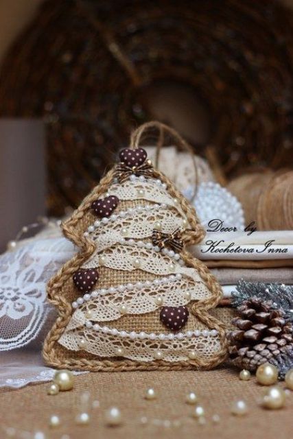 A vintage inspired burlap Christmas tree ornament with lace, beads and little hearts