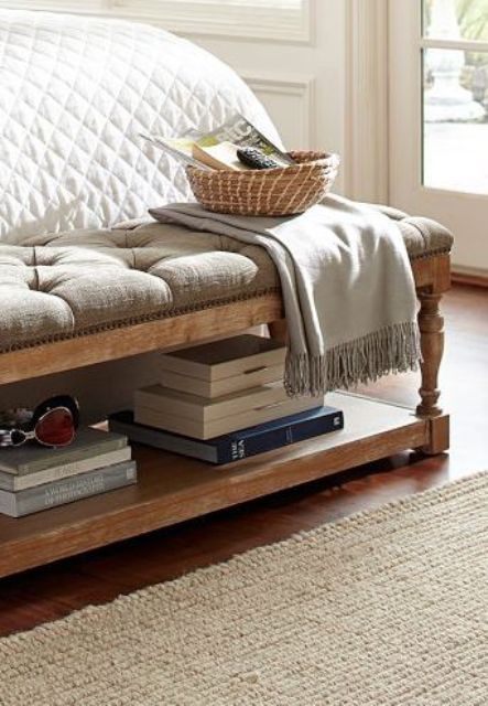 an upholstered vintage-style bench with an additional shelf inside