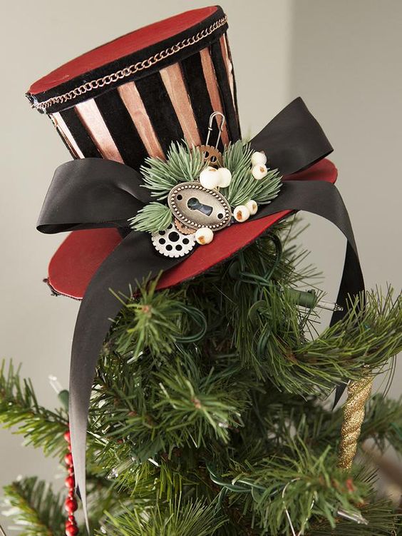 top the tree with a steampunk striped top hat with a ribbon bow and some berries