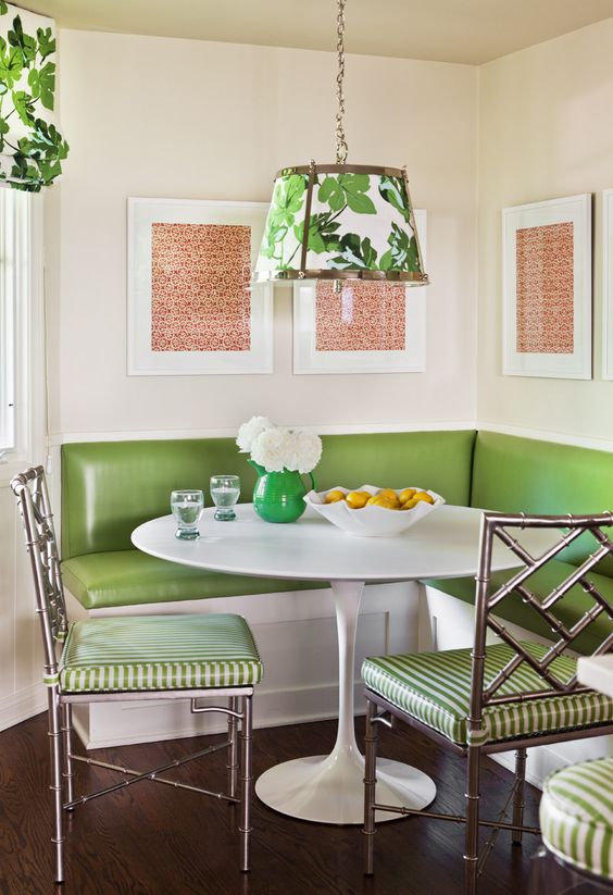 a retro diner space done in green, white and coral with botanical patterns
