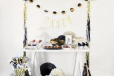 21 colorful fringe and black, gold and white balloons around will make any space party-like