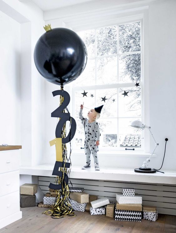 a large balloon with fringe and numbers for cool and simple New Year's decor