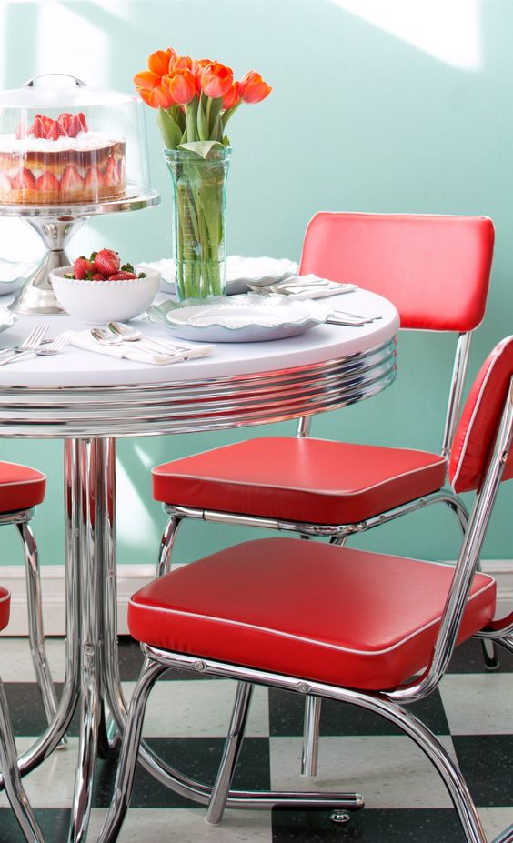 Red retro chairs and a diner styled round table are ideal for adding a retro feel to your space