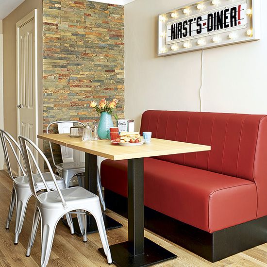 a retro dinign zone with an industrial feel, metal chairs and a marquee light sign