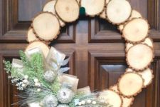 24 a wood slice Christmas wreath with silver frozen apples, faux greenery and berries