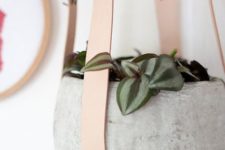28 concrete planters hanging on leather straps are ideal for an industrial or minimalist interior