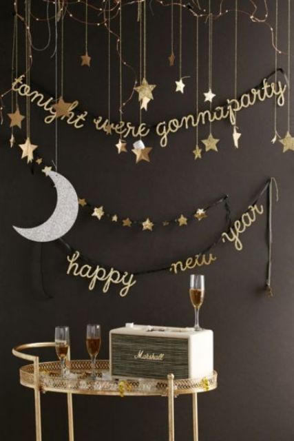 hanging stars, a moon and calligraphy garlands for decorating a drink station