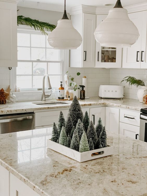 a modern farmhouse Christmas centerpiece of a tray with mini bottle brush Christmas trees is a cool idea