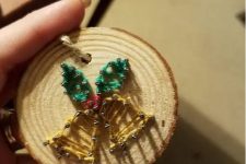 a tree slice Christmas ornament with string art, bells with leaves is a cute decoration you can DIY