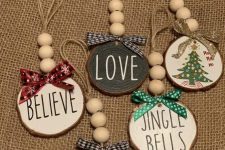 colorful tree slice Christmas ornaments with printed bows, wooden beads and letters are cool and cute