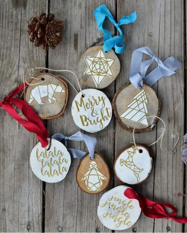 geometric wood slice ornaments with various decor, geometric animals and calligraphy are cool for tree decor