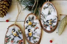gorgeous wood slice Christmas ornaments with painted birds on trees are very wintry – use stickers if you can’t paint