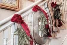 metal letters with evergreens, lights and red velvet ribbon is beautiful rustic decor for Christmas