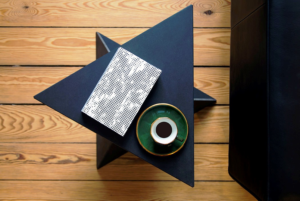 This chic bold side table is called VAI and features a cool and modern geometric design