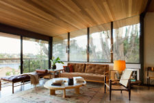 01 This gorgeous mid-century modern home is done with lots of wood, leather and furnished and decorated with impeccable taste