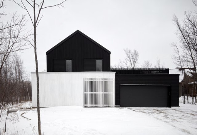 This modern chalet was inspired by local barns yet done in the modern black and white color scheme