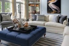 02 a large navy ottoman is a great fit for a beach or coastal space