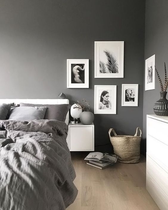 a stylish gallery wall with black and white pics for a monochrome space