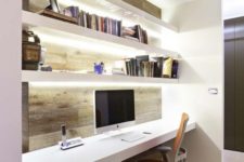 02 an ultra-modern workspace with lit up floating shelves and a desk for comfy working