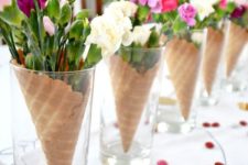 03 a cool galentine’s brunch centerpiece of ice cream cones filled with blooms